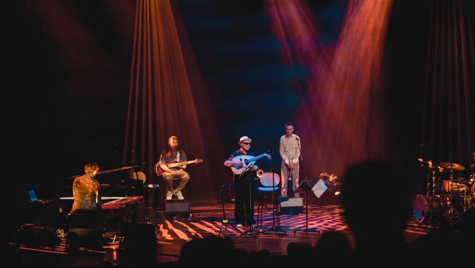 Drummer, pianist, guitarist, trumpeter and Dhafer Youssef on the stage. 
