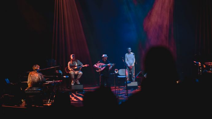 Pianist, guitarist, trumpeter and Dhafer Youssef on the stage. 
