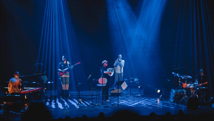 Drummer, pianist, guitarist, trumpeter and Dhafer Youssef on the stage. 